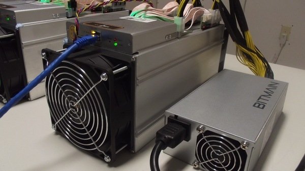 The Antminer S9 13.5 TH/s with separate power supply from Bitmain Technologies. (Photo by Michael Hooper)